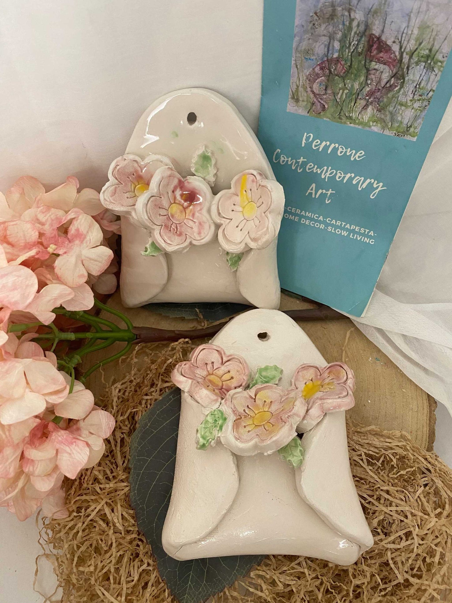 white ceramic wall decoration with delicate pink cherry blossom flowers from Ciliegio Collection, handmade artisan home decor