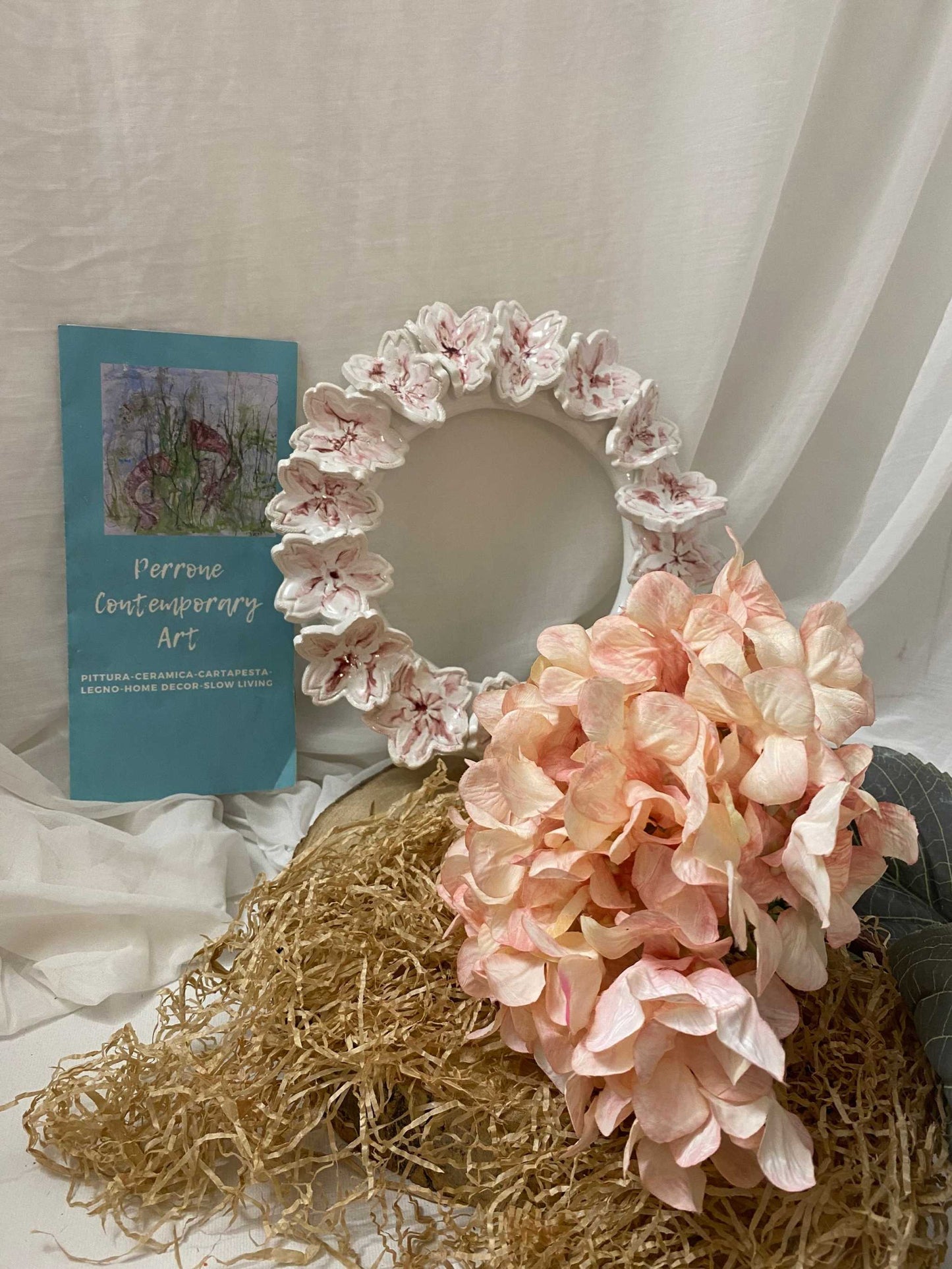Large white ceramic cherry blossom wreath from Ghirlanda grande Collezione Ciliegio with delicate floral design and elegant craftsmanship
