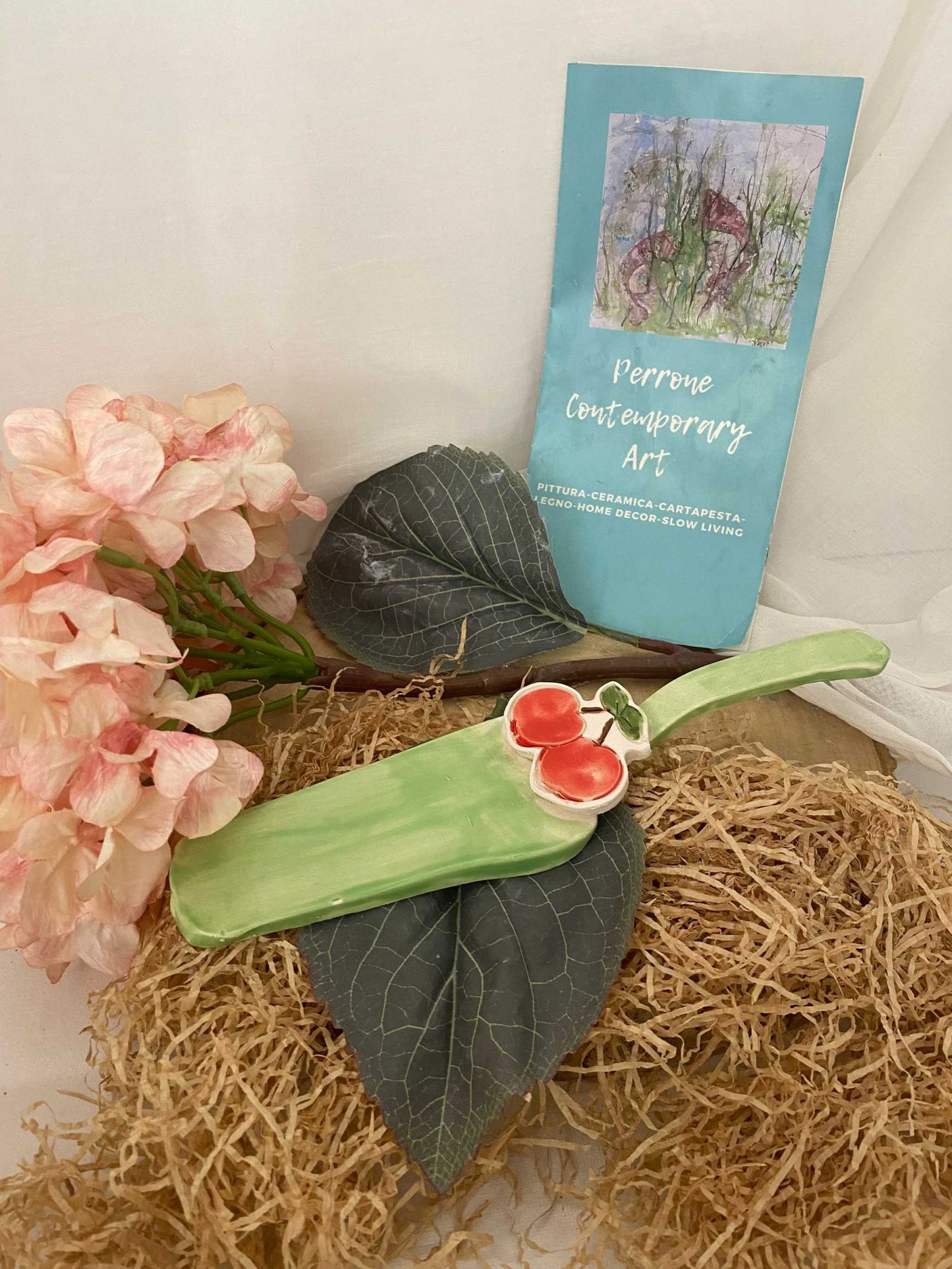Handmade white ceramic Paletta Torta cake server from Fruit Collection with pastel colors and cherry decoration, eco-friendly Italian craftsmanship