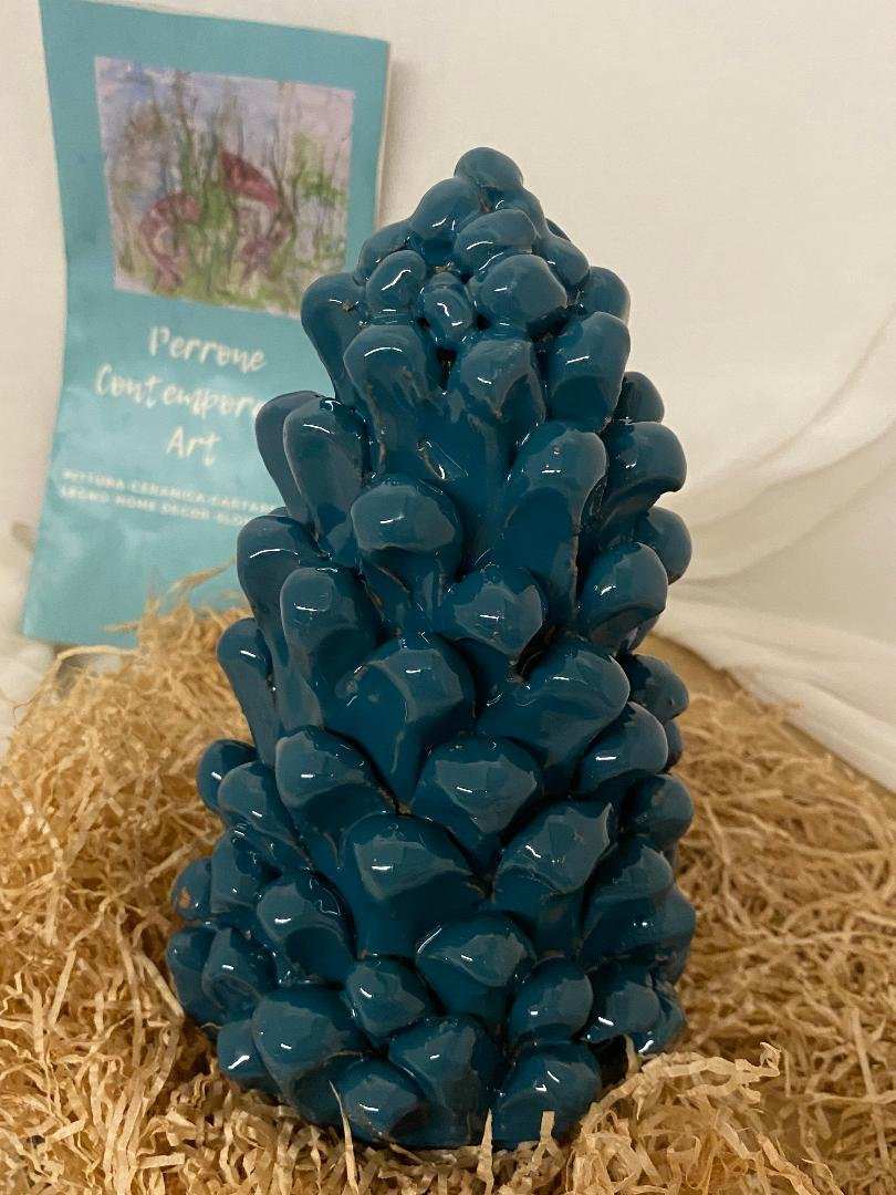 Handmade glossy ceramic pine cone in deep blue, artisan home decor accessory