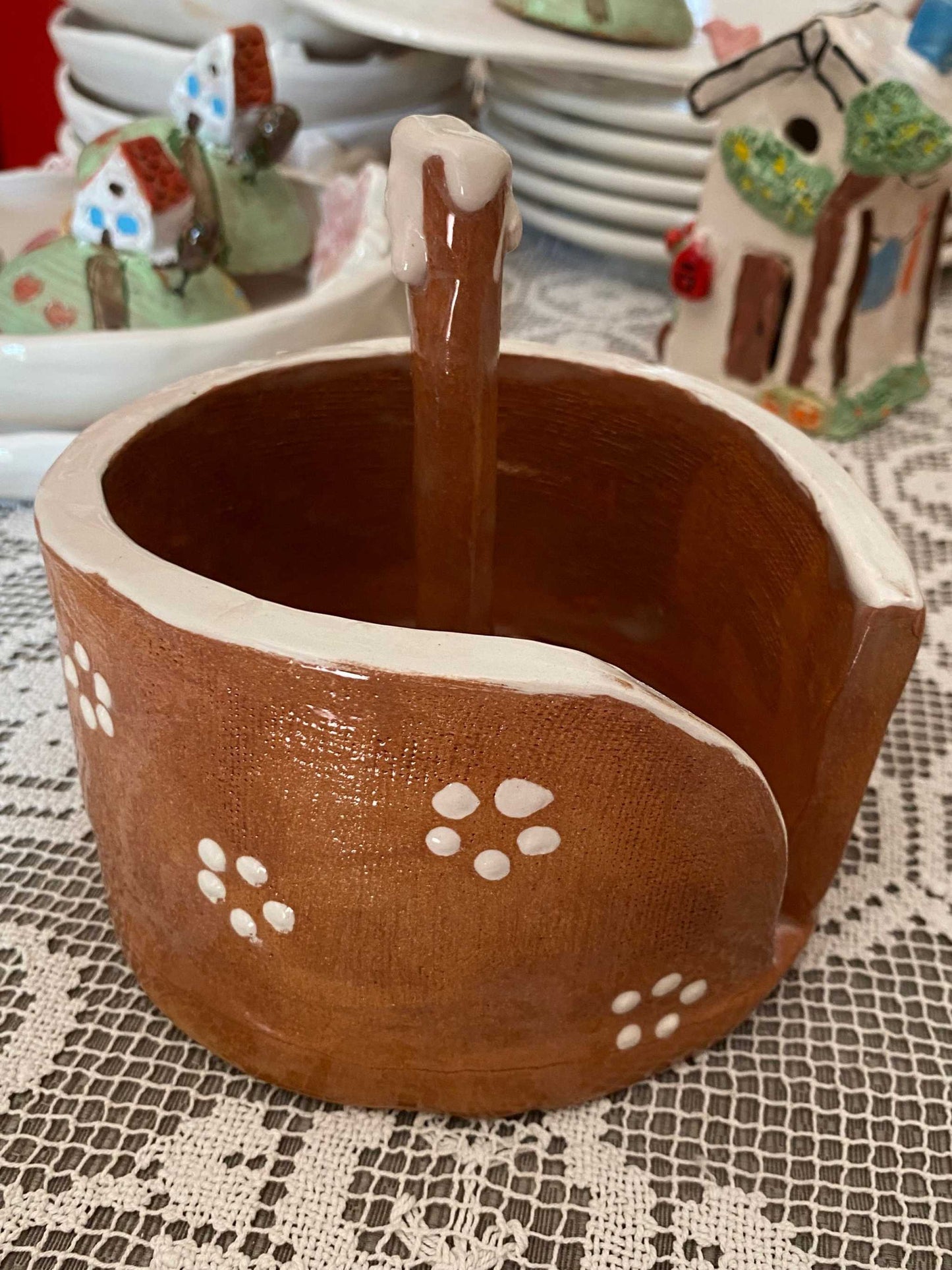 Hand-painted red ceramic porta rotolo with traditional Salento-style decoration, dishwasher safe and artisanal quality.