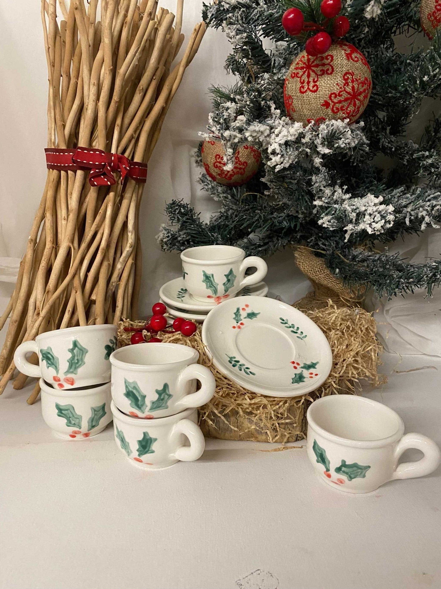 Handcrafted Christmas breakfast set for 6 with ceramic cups and saucers decorated with festive holly motifs