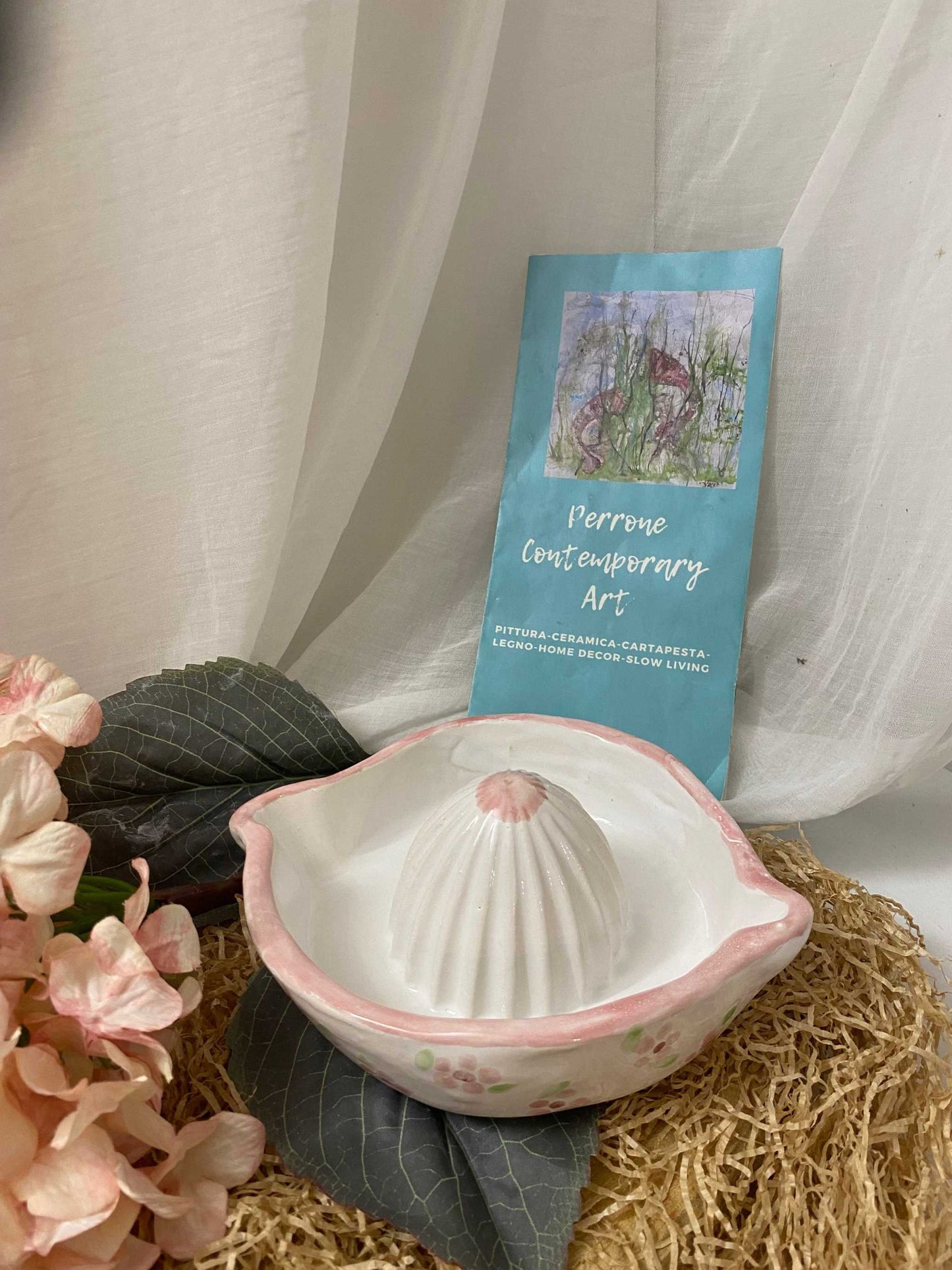 White ceramic Spremiagrumi della Collezione Primavera citrus juicer with dual spout and pink floral design, eco-friendly handmade Italian kitchen accessory