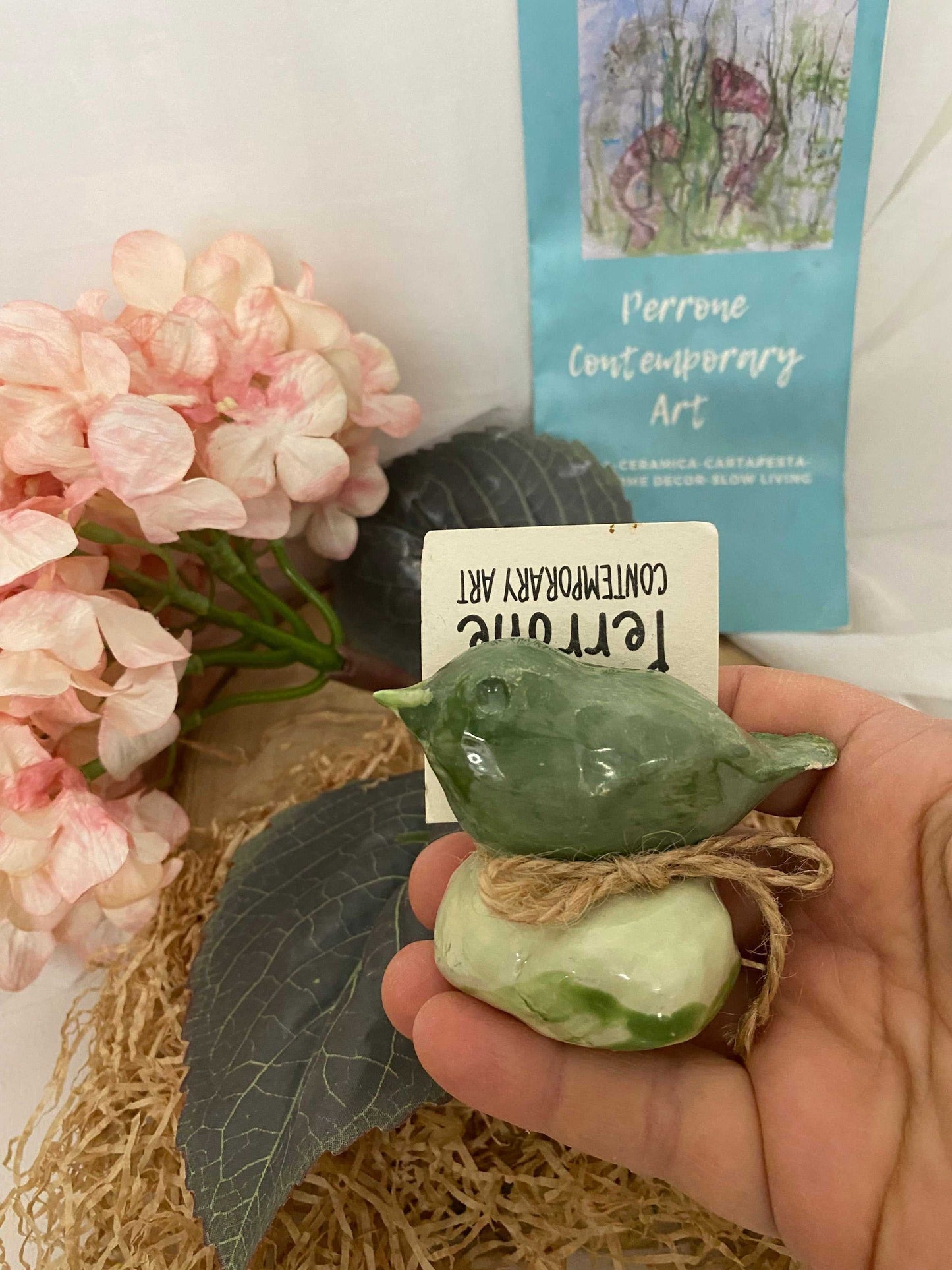 Handcrafted green ceramic bird ornament from the Spring Collection, ideal for home and garden decoration