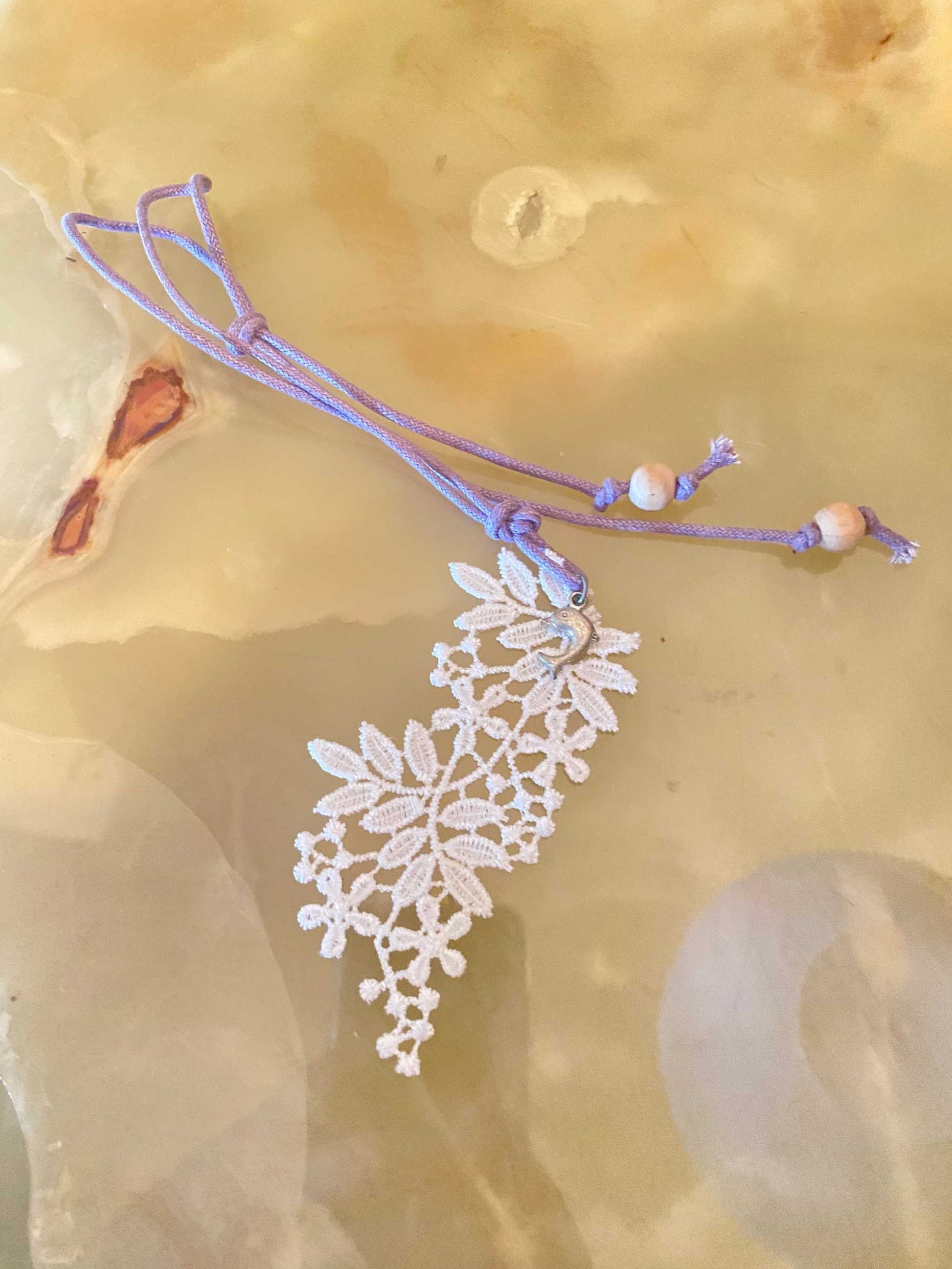 Handmade macrame lace pendant necklace with steel accents from Gocce del Salento collection