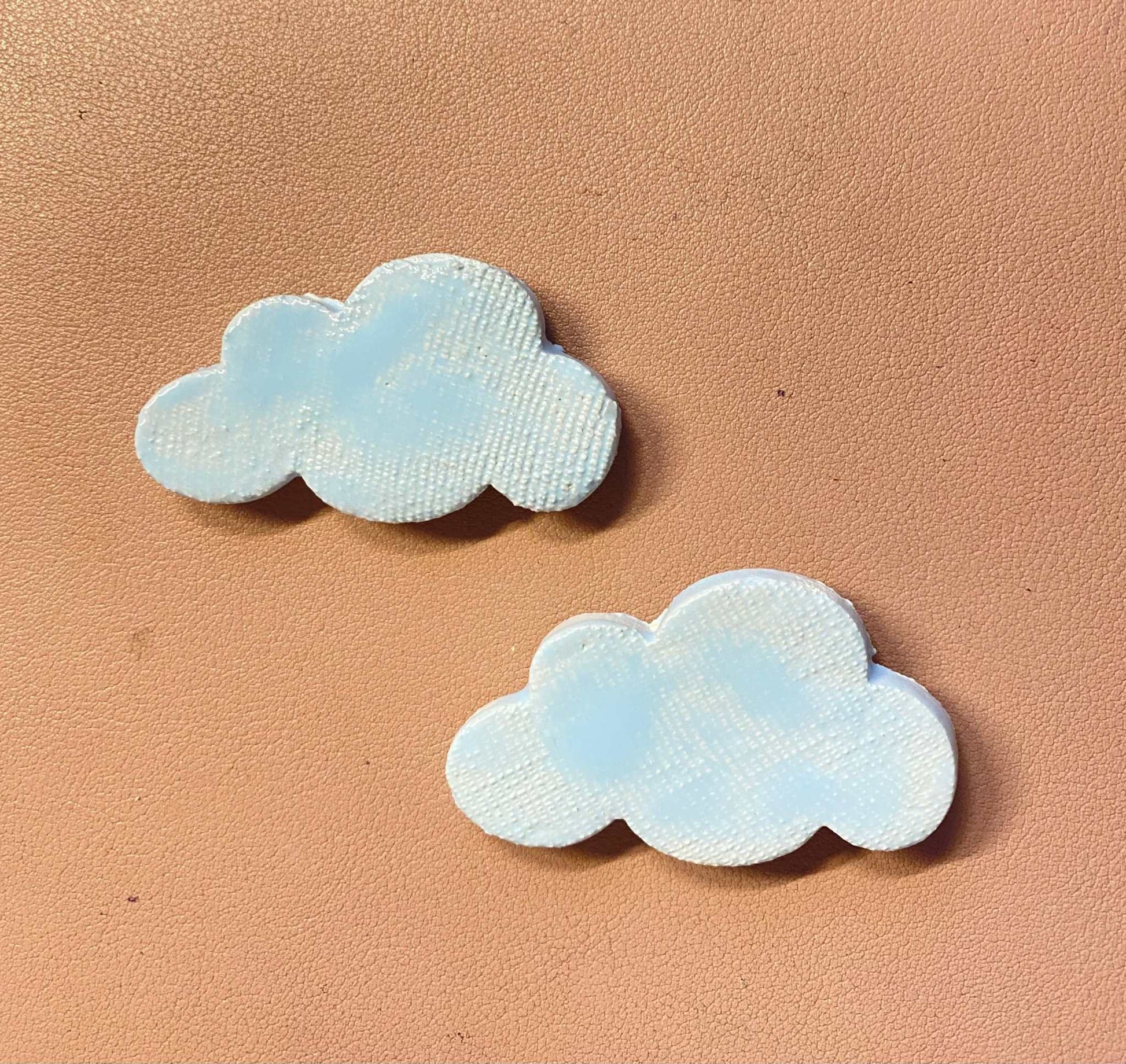 pair of light blue ceramic cloud magnets from Gocce del Salento collection