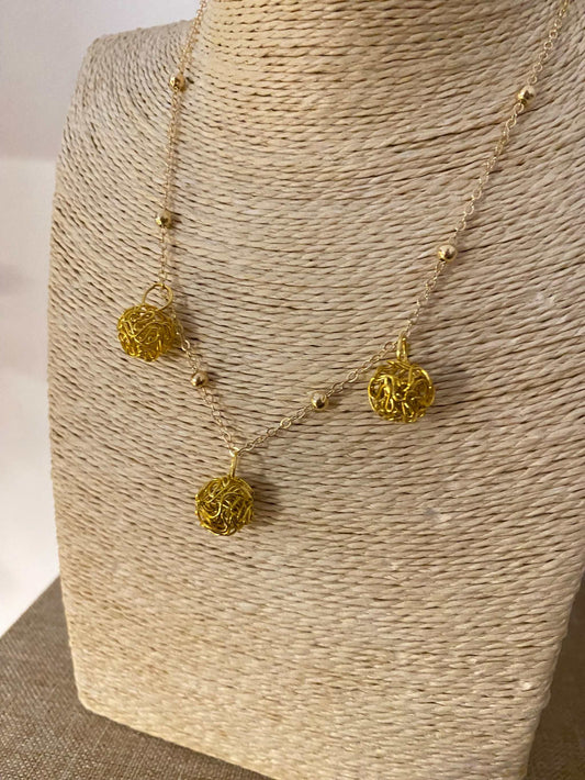 Gold stainless steel necklace with filigree spheres from Luxury Bijoux collection