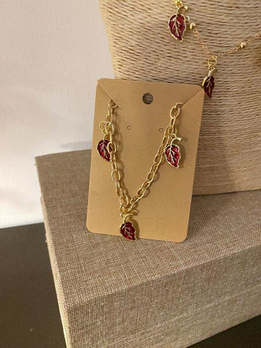 Golden stainless steel bracelet with delicate red leaf charms from Luxury Bijioux collection