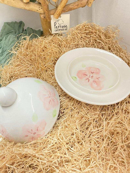 Handmade white ceramic butter dish with delicate cherry blossom design from the Ciliegio Collection, featuring matte finish and elegant knob.