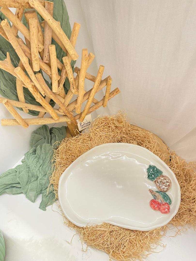 white ceramic tray from Fruit Collection with decorative fruit accents and handmade design