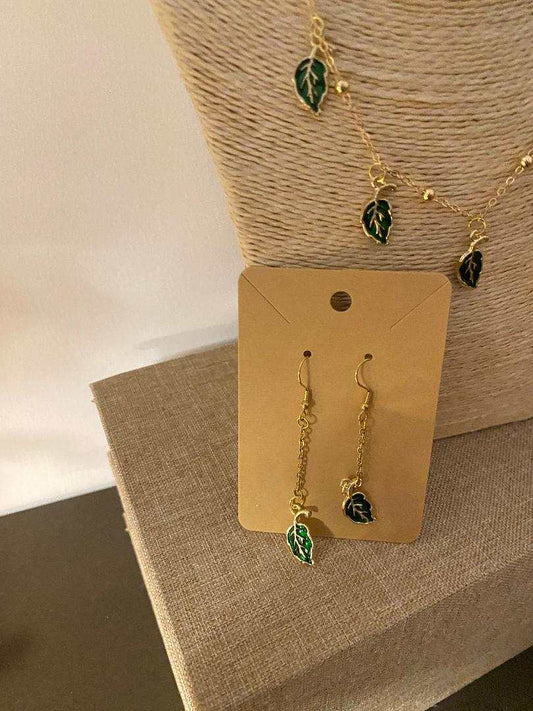 Golden stainless steel earrings with long green leaf pendant from Luxury Bijioux collection